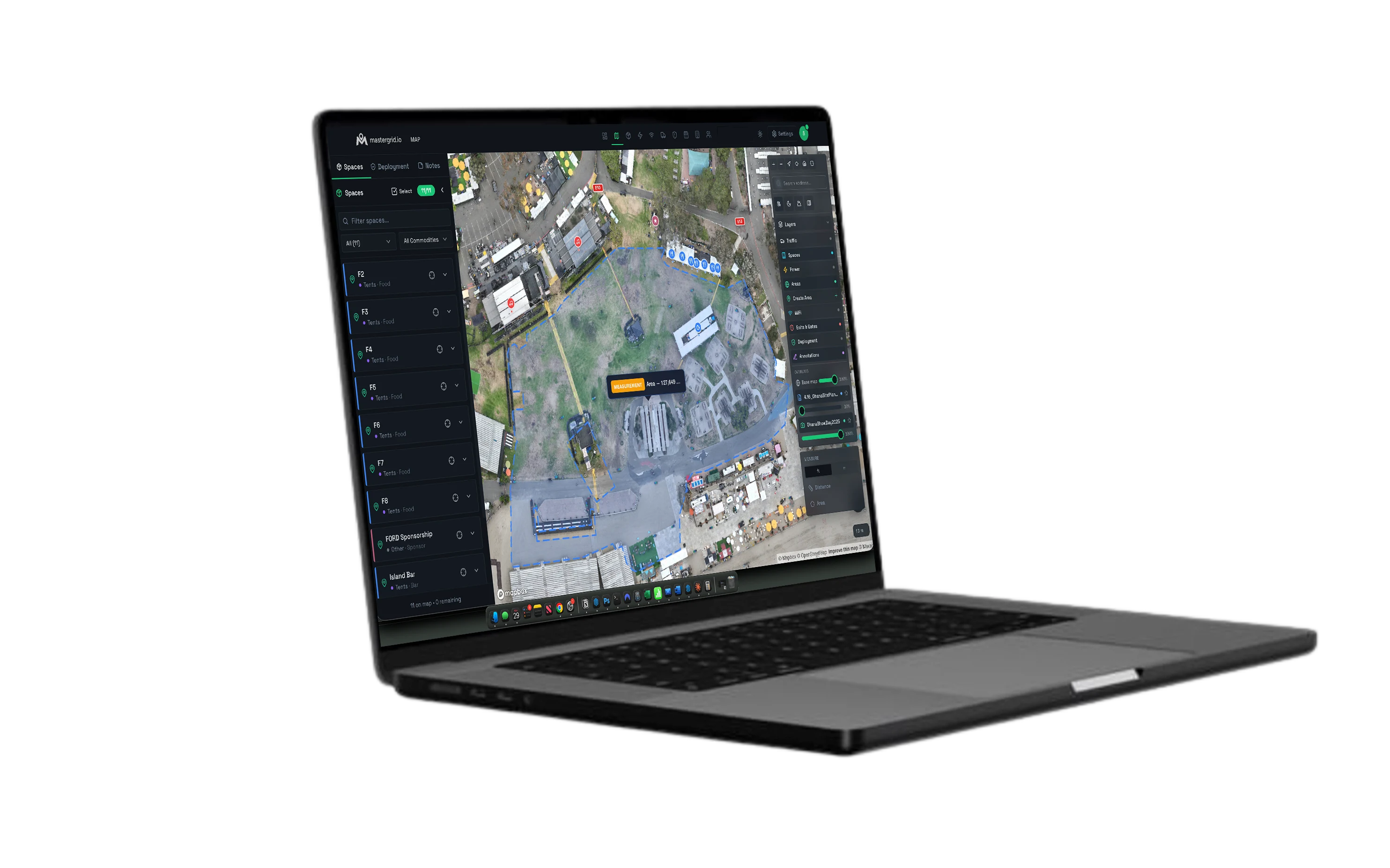 MasterGrid Map on a laptop: a geo-referenced CAD site plan over as-built drone imagery, a Spaces panel listing tents and vendors, a layers panel for traffic, power, areas, and deployment, and an on-map area measurement.